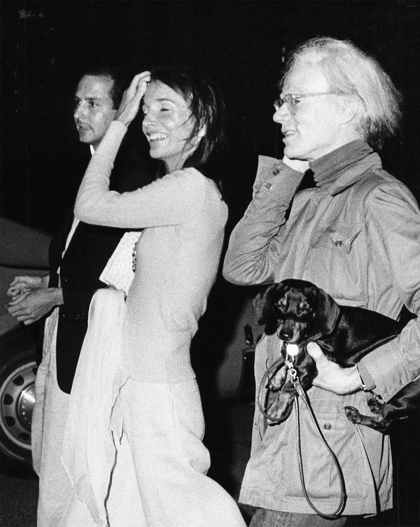 Ron Galella, Andy Warhol (+ his dog Archie), Lee Radziwill and Fred Hughes at a benefit cocktail party in Montauk, New York, July 28, 1973