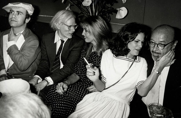 Ron Galella, Elton John, Andy Warhol, Jerry Hall, Barbara Allen and Ahmet Ertegun attend birthday party for Grace Jones at Studio 54, New York City, June 12, 1978