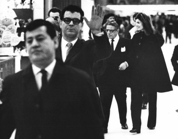 Ron Galella, Jackie escorts Ari to JKF Olympic Terminal, February 20, 1971