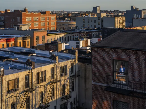 Gail Albert Halaban, SInging to the dog, Bronx, 2026