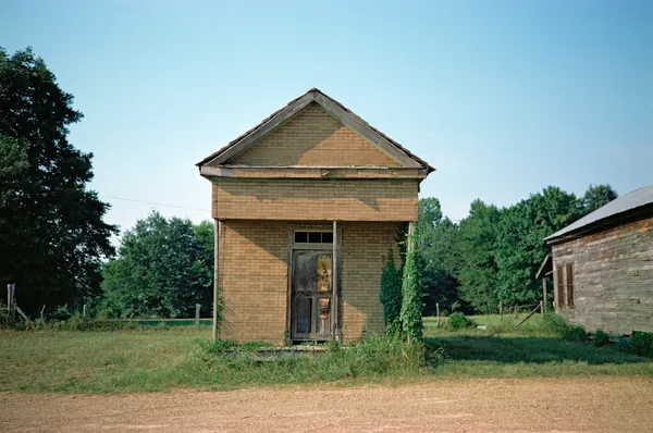 William Christenberry, Building with False Brick Siding, Warsaw, Alabama, 1974