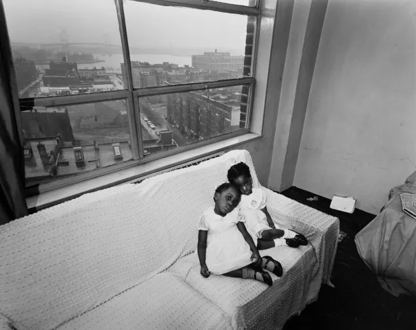 Bruce Davidson, Untitled, East 100th Street (Two Girls in Dresses on Couch), 1966-68