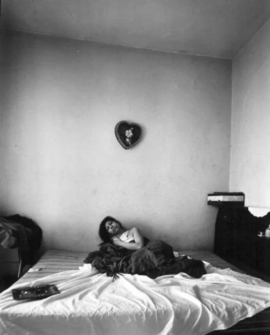 Bruce Davidson, Untitled, East 100th Street (Woman on Bed with Valentine on Wall), 1966 - 68