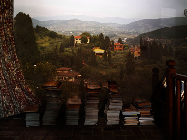 Abelardo Morell, Camera Obscura: View of Landscape Outside Florence in Room with Books, 2010