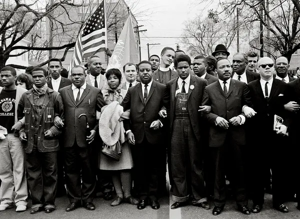 Steve Schapiro, Martin Luther King and Group Enter Montgomery (Black Suits), 1965