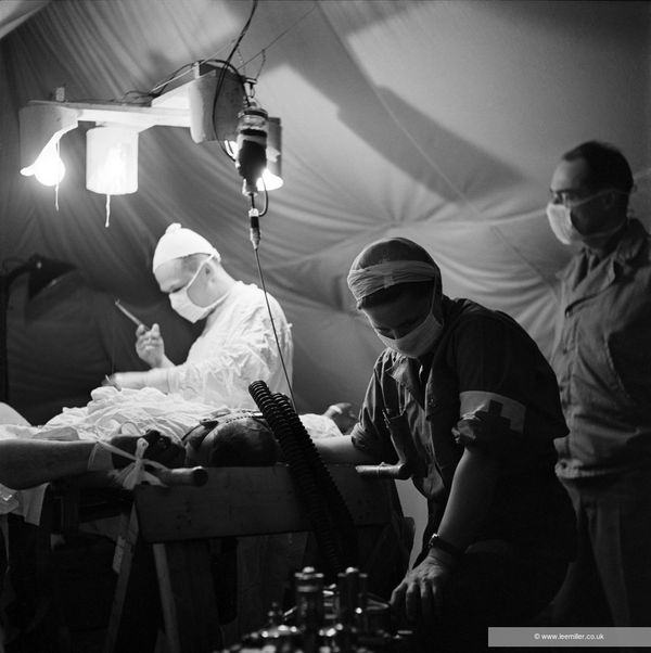 Lee Miller Surgeon and anaesthetist at 44th Evacuation Hospital, Near La Cambe, Normandy, France, 1944 Fine Archival Gelatin Silver print. Non-Editioned. Image size: 25.4 x 25.4 cm (10 x 10 in) Paper size: 40.3 x 30.3 cm (15 7/8 x 11 7/8 in)