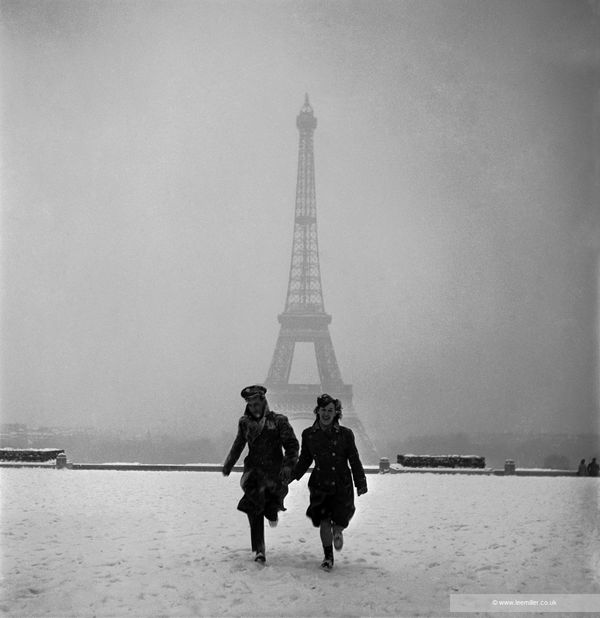 Lee Miller Couple running 'Veiled Eiffel Tower', Paris, France, 1944 Platinum Palladium print. From the edition of 30. Printed for the Lee Miller Archives by 31 Studio. Image size: 27.9 x 26.8 cm (11 x 10 1/2 in) Paper size: 48.5 x 37.7 cm (19 1/8 x 14 7/8 in)