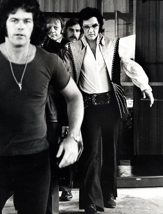 Ron Galella, Elvis and bodyguards depart the Hilton Hotel, Philadelphia, PA, June 25, 1974