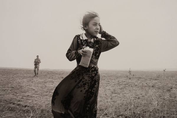 Paolo Pellegrin, Refugees from the village of Bajurbuk, near Bashiqa. Told by ISIS that they were to be moved to Mosul the following day, the village residents fled their homes in the middle of the night and took refuge behind Peshmerga lines. Iraq, 2016, 2016