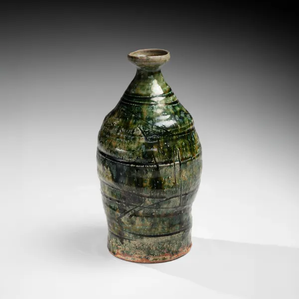 OKABE MINEO, Oribe-glazed vase with narrow neck, flaring mouth, and carved banding, 1955