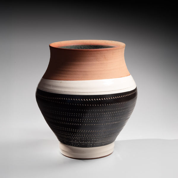 Broad vessel with wide, unglazed mouth and textured roulette-patterning