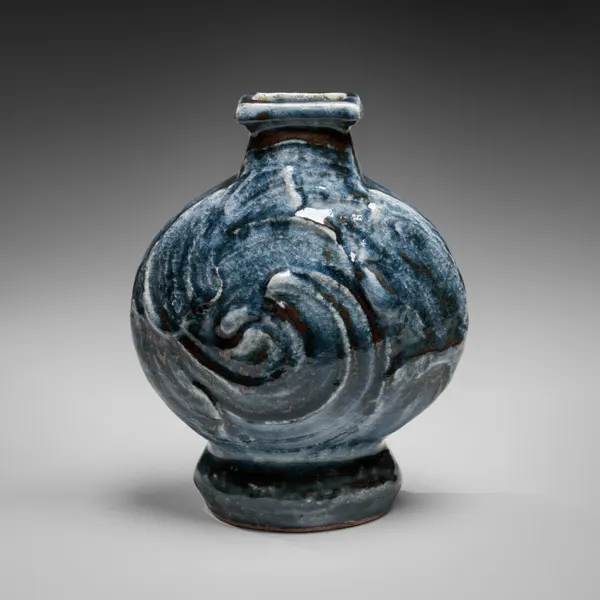 KAWAI KANJIRŌ, Cobalt-glazed (gosu) flattened circular vessel with raised rectangular mouth and carved decoration, ca. 1950s-60s