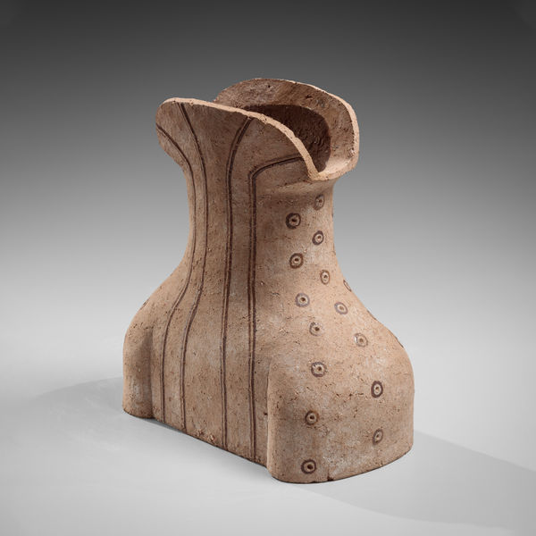 Cinched torso-like vessel with incised linear and dot motifs accentuated with slip and glaze