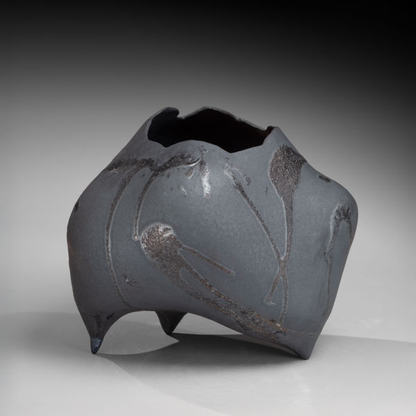 Black biomorphic vessel with black dripping glaze