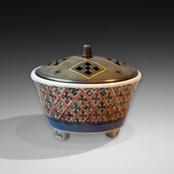 TOMIMOTO KENKICHI, Iro-e (enamel overglaze) incense burner with geometric polychrome diamond-shaped designs and perforated metal lid, 1949