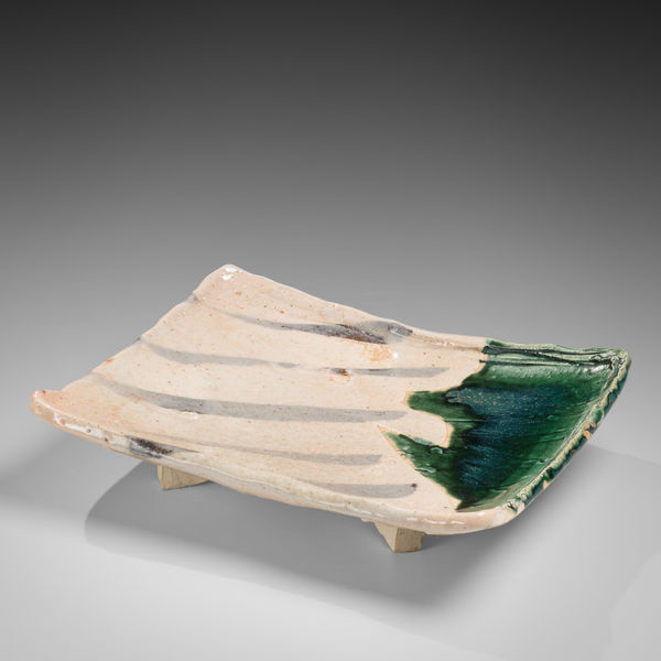 Shino and Oribe-glazed rectangular platter with four feet