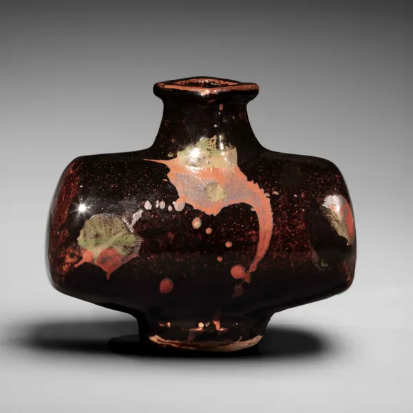 KAWAI KANJIRŌ, Black barrel-shaped vessel with splashed patterning in red and green, ca. 1960