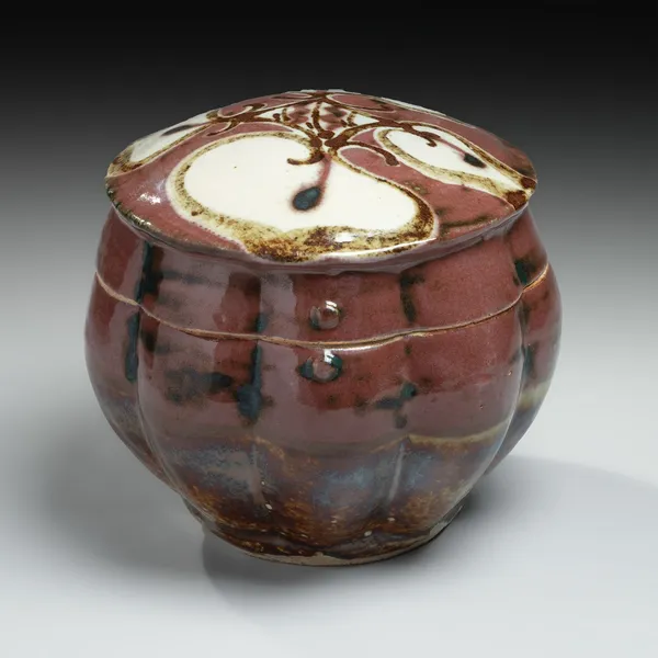 KAWAI KANJIRŌ, Red copper-glazed, lobed, covered box with floral design, ca. 1950