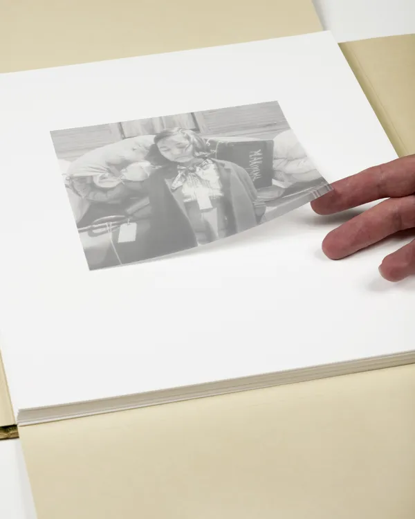 Kimiko Kitagaki guarding family luggage for busride to Tanforan Assembly Center - Photograph by Dorothea Lange, 1942, 2025