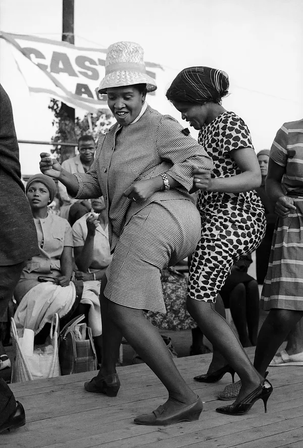 Alf Kumalo, Two women dancing, Orlando Stadium, Soweto, c.1960