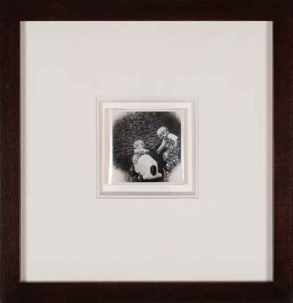 John Latour, Two Small Children Playing with a Toy Racing Car, 2021