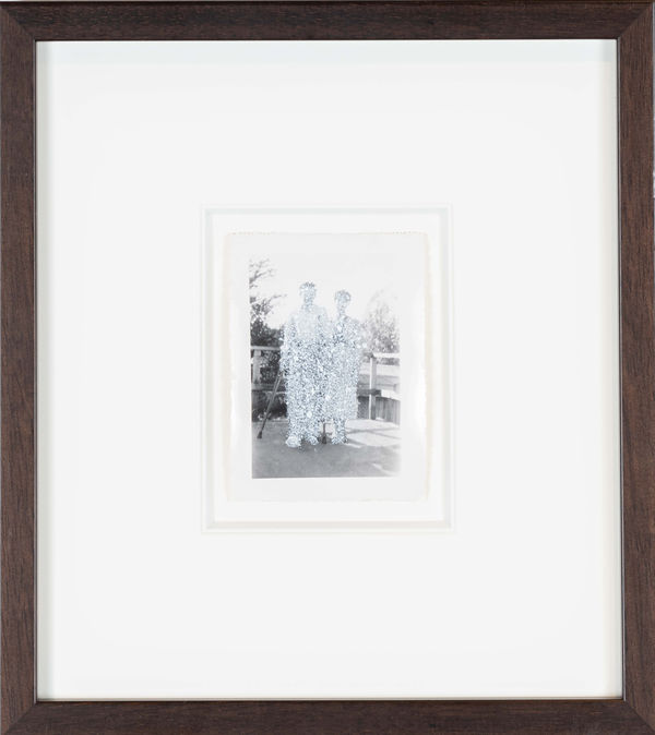 John Latour, Young man in crutches with well-dressed woman, 2008