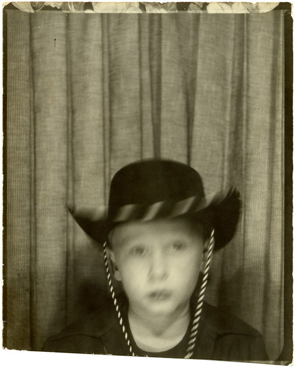 ENLARGEMENT REPRINT Vernacular, Untitled, [Photobooth Studio portrait of a young boy wearing a cowboy hat, motion blurred]