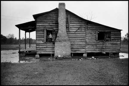 Bruce Davidson, Felicia Blackman Holding Daughter, Felicia in Cabin Window. Trickum Forks, Alabama, 1965
