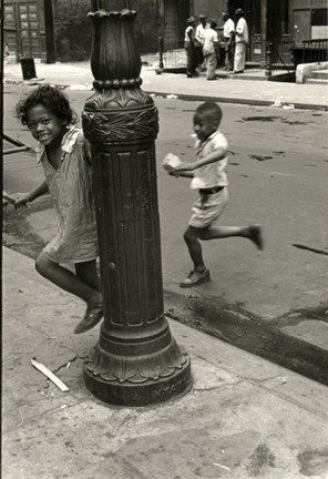 Helen Levitt, Boy and Girl Running, Lamp Post, Little Black Girl Looking at Camera, 1942