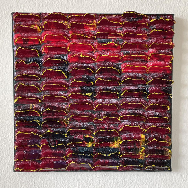 Mixed dark red, navy, light red, yellow on dark green with yellow tips