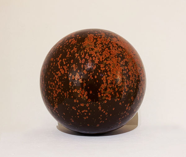Clare Flatley Planetary Bodies II, 2021 Stoneware, iron glaze 25 cm diameter