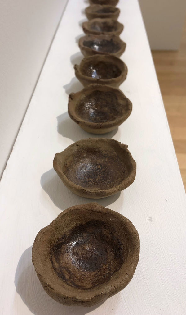 Eilidh Guthrie Wild Clay and Natural Glazes, 2024 Wild clay with glazes: bracken ash; moss ash; seaweed ash; iron ochre; rock and quartz; eggshell; straw ash; solid seaweed; straw ash and bracken ash; straw ash and moss ash; straw ash and seaweed ash; straw ash and iron ochre 3 x 3 x 2 cm each