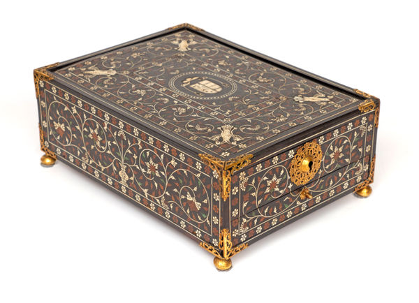 An Indo-Portuguese Thane writing box with an ecclesiastical coat of arms, Northern Province of the Portuguese State of India, Thane (?); 1550–1600 teak, ebony, rosewood, sandalwood, ivory, bone, brass, iron and gilt-copper 13.5 × 26.0 × 35.3 cm