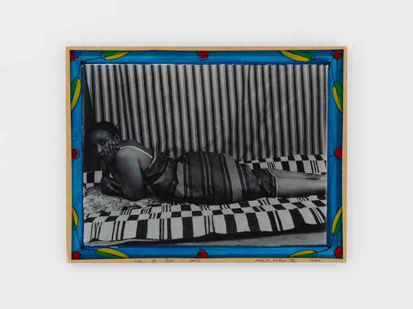 Malick Sidibé Vues de dos, 2003 Silver gelatin print, glass, paint, cardboard, tape, string 13 x 17 inches, framed