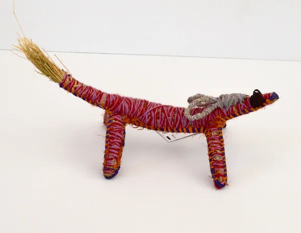Tracey Yates Papa (Dog), 2022 raffia, tjanpi, acrylic wool 45 x 20 x 30 cm