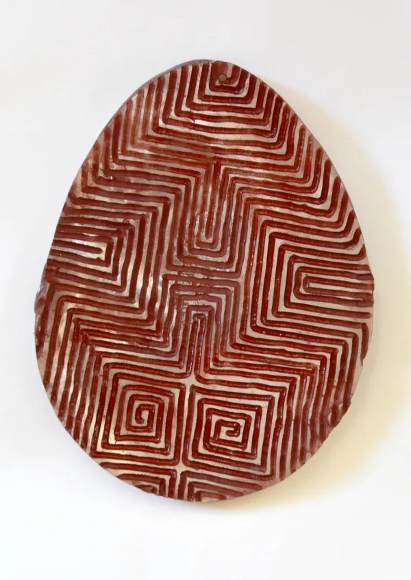 Sebastian Arrow Jalinyi, 2023 Ochre & acrylic on carved pearl shell 16 x 12 cm