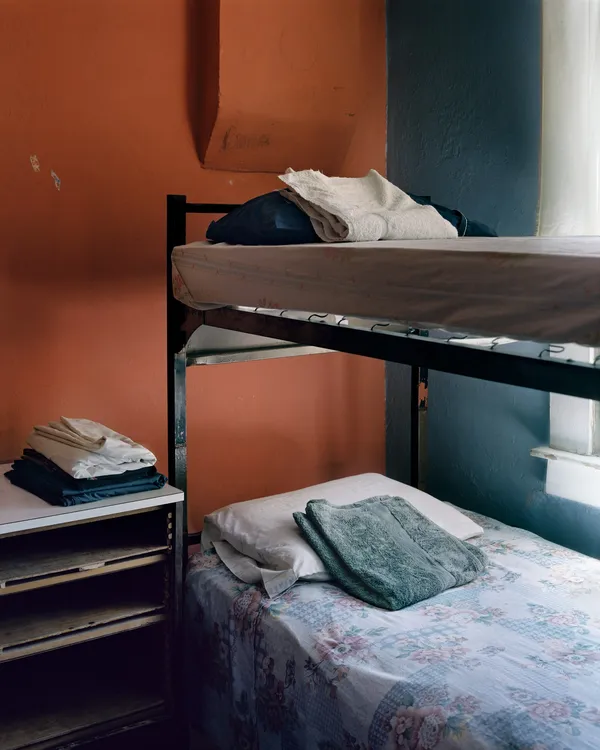 Mitch Epstein Refugee Halfway House, El Paso, Texas 2017confirm title, Amon Carer listed as "Casa Vides Refugee Halfway House, El Paso, Texas 2017", 2017 Chromogenic print 89.875 x 71 inches 228.3 x 180.3 cm Edition 1 of 6