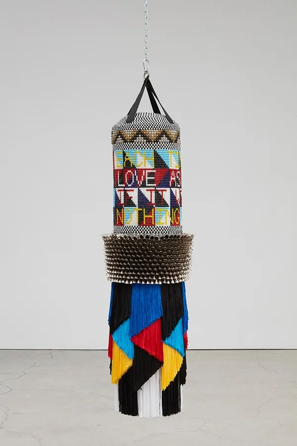 Jeffrey Gibson NOTHING IS ETERNAL, 2018 Repurposed punching bag, acrylic felt, glass beads, metal jingles, artificial sinew, and nylon fringe 63 x 22 x 22 inches 160 x 55.9 x 55.9 cm