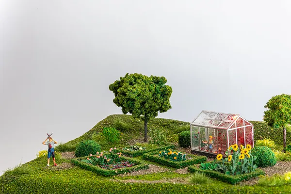 miniature diorama by Abigail Goldman of a person gardening and a dead body in their green house