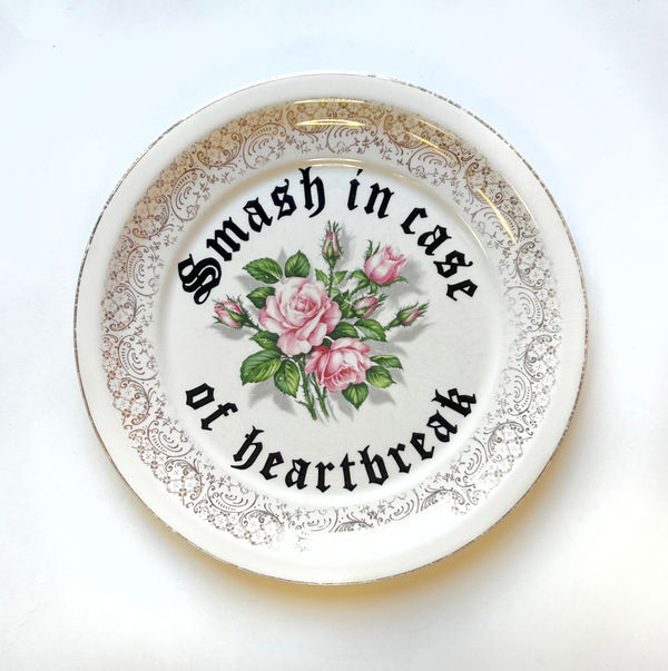 Plate reading "Smash In Case Of Heartbreak"