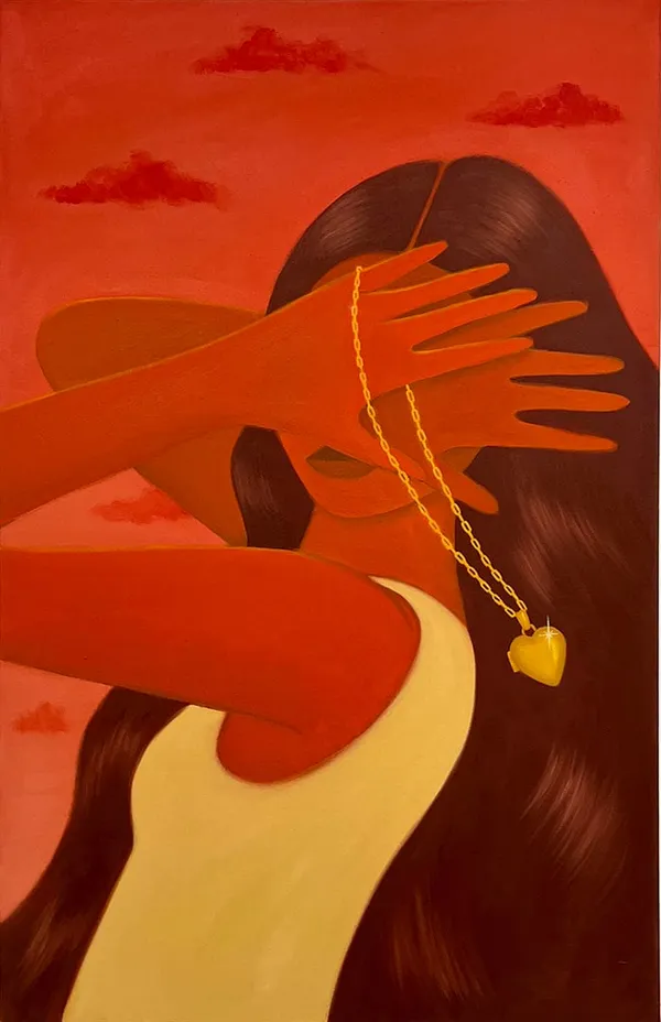 woman holding her hands in front of her face and a locket