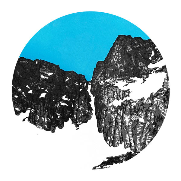 Circular painting of a snow covered mountain against a bright blue sky