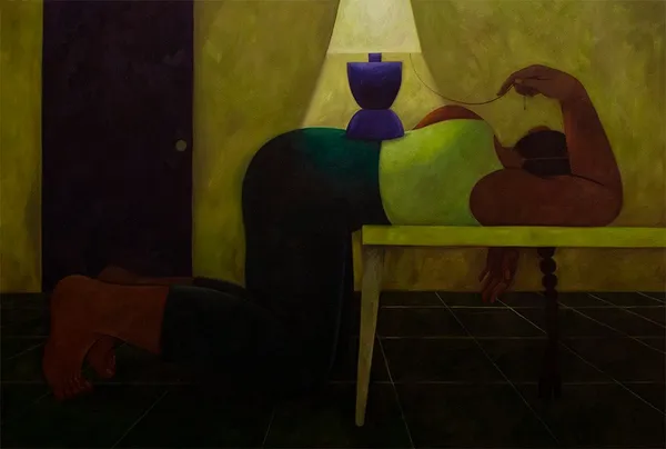 Woman leaning over a table faced away from the viewer in dim lighting