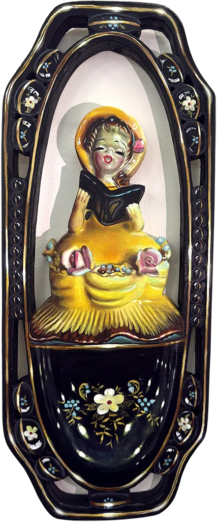 Sculpture of a woman wearing a yellow hat and a yellow dress