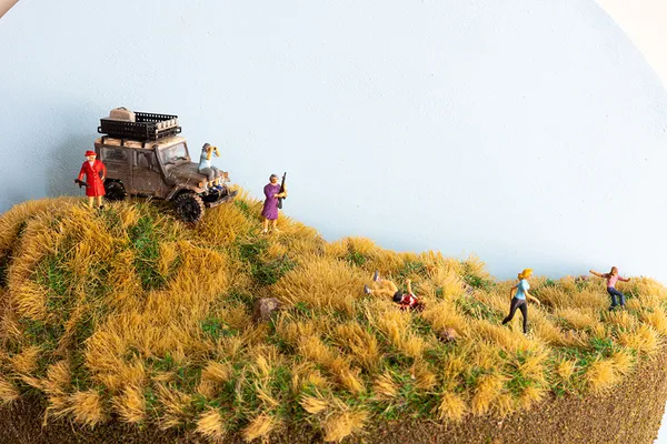 miniature diorama by Abigail Goldman of three elderly woman hunting a group of people running away