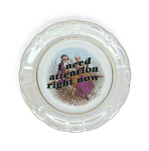 ceramic plates with words painted on them