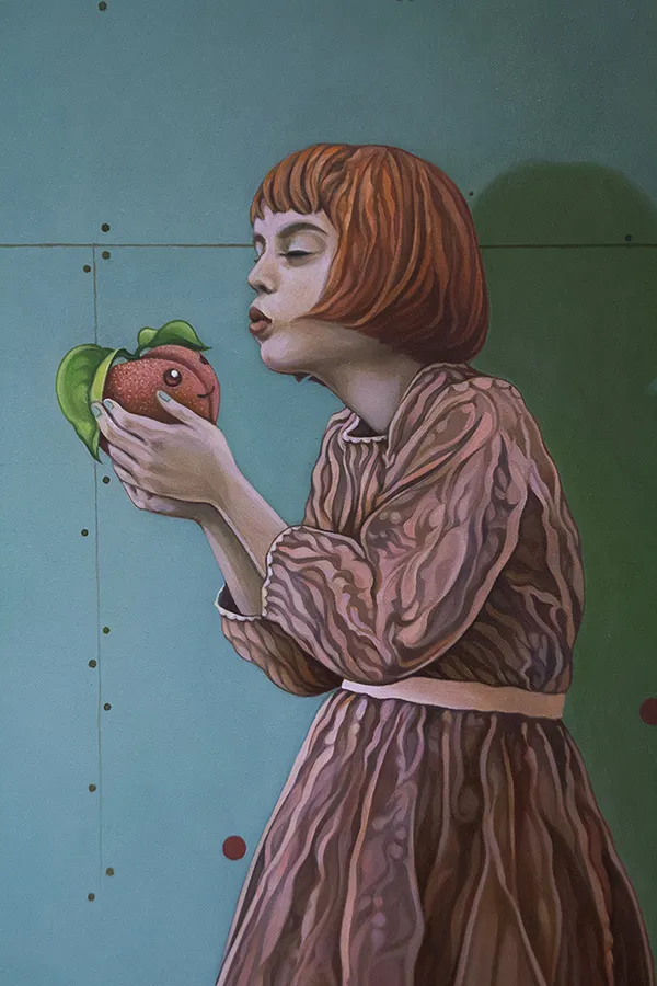 Painting of a girl with a red bob holding a peach with a face on it
