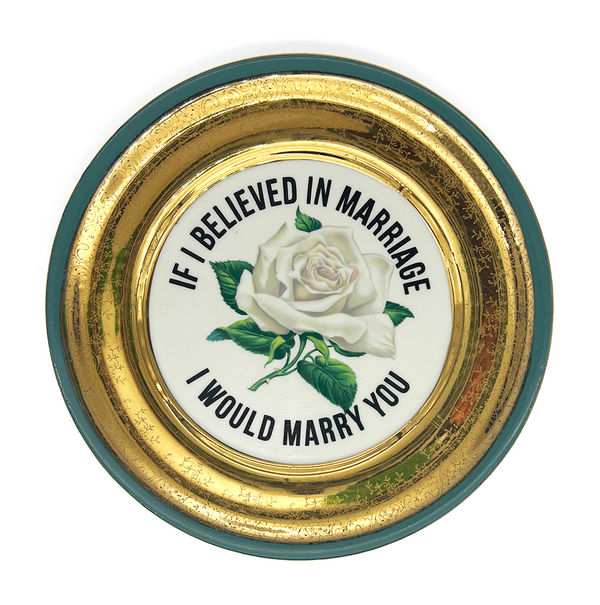 ceramic plates with words painted on them