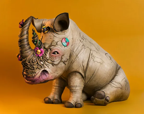 Dulk rhino sculpture with flowers on tusk