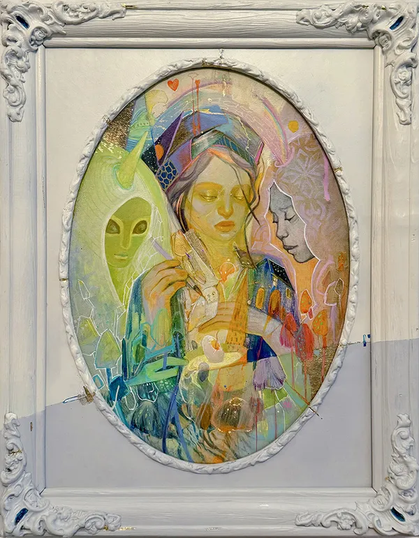 Framed painting of three colorful figures in veils